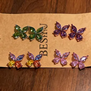 Set of four pairs of butterfly stud earrings featuring colorful marquise-cut zircon stones