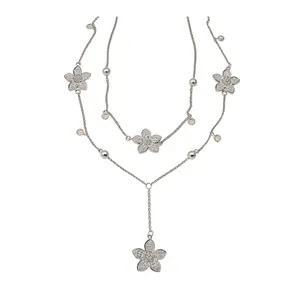 Elegant multi-layered silver necklace featuring sparkling crystal flowers and white pearls