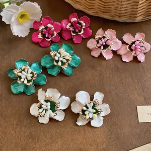 Elegant floral enamel stud earrings in vibrant colors with metallic finish for women