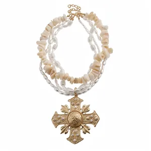 Multi-layered pearl and shell choker necklace with ornate golden cross pendant for women