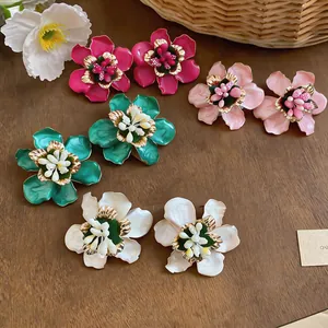 Elegant collection of handmade enamel flower stud earrings in various vibrant colors