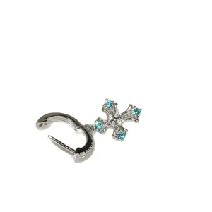 Elegant sterling silver cross pendant earring with sparkling blue and clear zircons