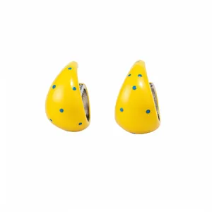 Yellow polka dot C-shaped hoop earrings with blue spots for a fresh summer style.