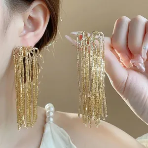 Elegant gold fireworks glass tassel earrings with long fringe and silver needles for women