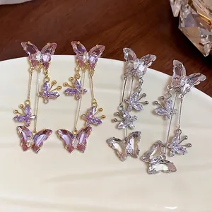 Élégantes boucles d'oreilles clips papillon en zircon, styles violet et cristal.