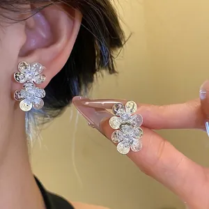 Vintage silver-tone zircon flower stud earrings for elegant feminine style jewelry