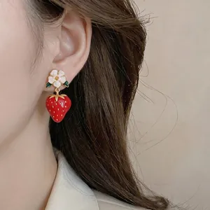 Dainty red strawberry and white flower drop earrings in a charming and sweet aesthetic style