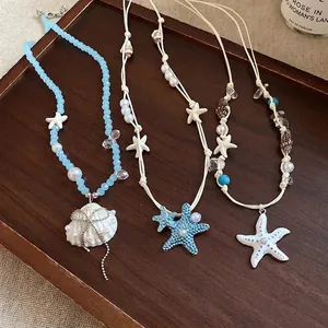 Set di tre collane boho con pendenti a conchiglia e stella marina per vacanze al mare