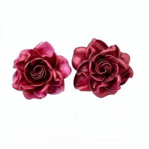 Elegant resin rose flower stud earrings with realistic petal texture on white background