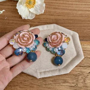 Elegant French vintage resin flower stud earrings with blue crystals and pearls