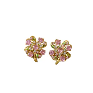 Elegant 14k gold plated flower stud earrings featuring pink and clear cubic zirconia stones