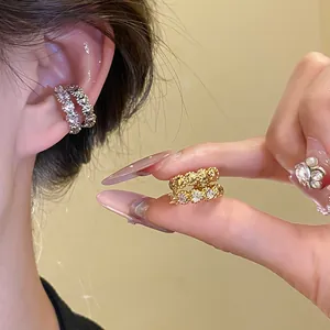 Close-up of double-layer zircon ear cuff showing sparkling detail and ear fit