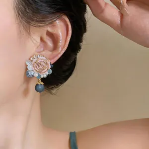 Elegant French vintage resin rose stud earrings with dark beads shown on model ear