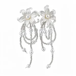 Elegant silver-tone flower stud earrings featuring cascading pearl tassels on white background