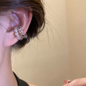 Detailed view of a sparkling silver-plated zircon double-layer ear cuff on a female model.