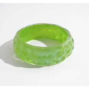 Vibrant green iridescent resin bangle with textured dimple pattern for women