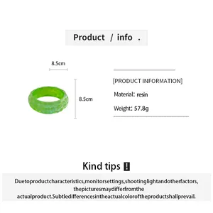 Detailed view of green pleated resin bangle with material weight and 8.5cm dimensions