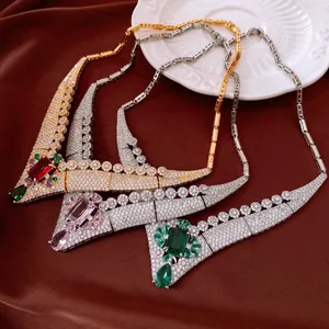 Detail view of vintage palace-style chokers with colorful square and teardrop stones