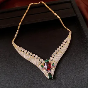 Detail shot of a vintage palace style 18k gold plated necklace with colorful crystals