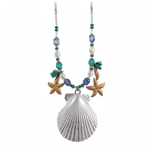 Vacation style necklace featuring seashell and starfish charms with pearls and turquoise.