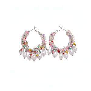 Colorful beaded hoop earrings with white pearl dangles in a vibrant vacation style