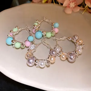 Elegant silver-toned hoop earrings featuring colorful pastel beads and shimmering pearls