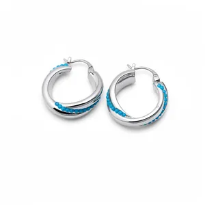 Elegant silver oval hoop earrings featuring vibrant blue beads, minimalist trendy jewelry