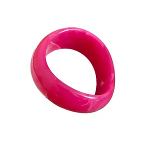 Vibrant pink resin bangle with white marble swirl finish for a bold fashion statement
