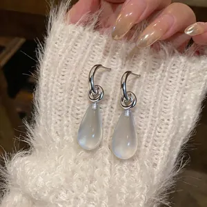 Elegant silver needle C-shaped resin teardrop earrings with a soft matte finish