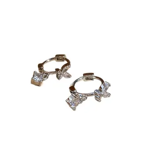 Elegant silver hoop earrings featuring butterfly and square cubic zirconia dangles for women.