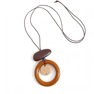 Retro ethnic long necklace with wooden ring and carved floral pendant, adjustable cord