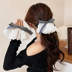 Elegant stylish white lace bow hair clips with navy checkered and grey ribbons