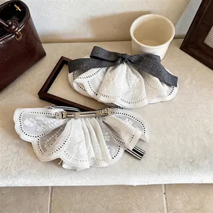 Elegant white lace ruffle hair clip with grey ribbon bow and durable metal spring clip