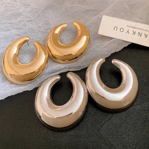 Orecchini a perno ovali cavi in metallo lucido, oro e argento, con perni in argento