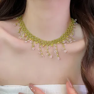 Intricate handmade green and pink glass bead lace choker necklace detail on neck