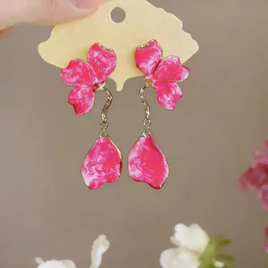Elegant vibrant pink enamel flower drop earrings featuring a unique minimalist petal design