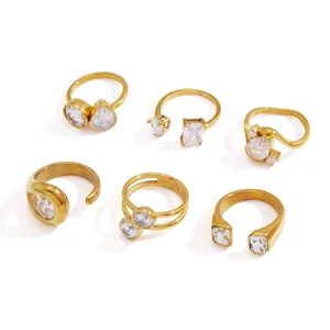 Set of six gold plated stainless steel rings with clear zircon stones for women