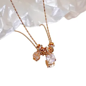 Elegant 18k gold plated necklace featuring a square zirconia pendant and a lucky coin charm