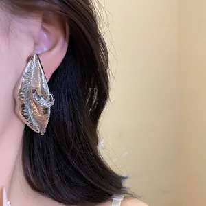 Vintage silver lip stud earring with sparkling rhinestone ring detail in a macro view