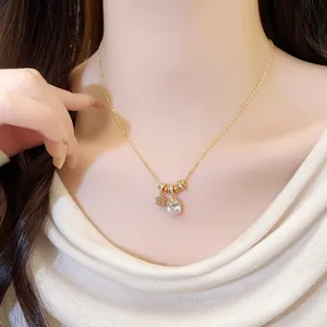 Close-up detail of 18k gold plated necklace with a square cubic zirconia pendant