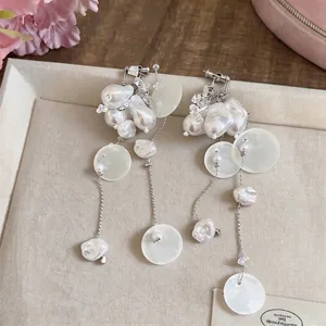 French vintage faux pearl clip-on earrings with elegant long tassel and shell details