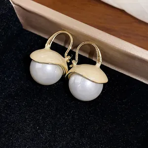Elegant French-style cream enamel and large round pearl hoop earrings for luxury wear.
