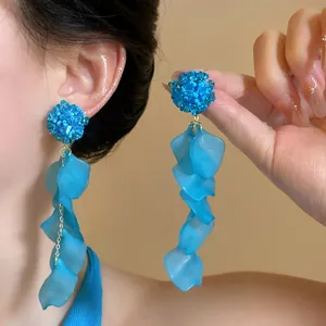 Close-up of elegant blue hydrangea earrings with long translucent petal tassels