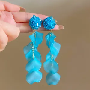 Close-up of elegant blue hydrangea petal tassel earrings with vibrant beaded top detail