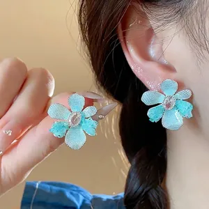 Elegant blue zirconia glass flower stud earrings for a chic minimalist look