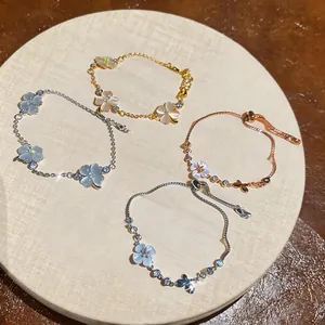 Detailed view of elegant zircon and cat eye stone flower bracelets in various metal finishes