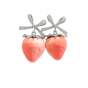 Sweet pink strawberry stud earrings featuring sparkling CZ bow knots in a silver finish