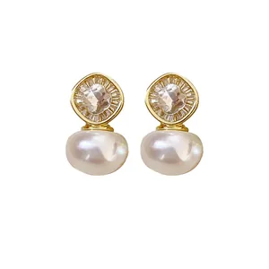 Elegant oval pearl stud earrings with sparkling zircon accents for women's jewelry collection