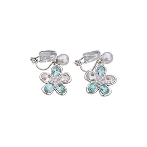 Elegant silver-toned flower clip-on earrings featuring light green crystals and pearls