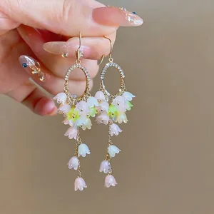 Elegant lily-of-the-valley dangle earrings with rhinestones and pastel flowers